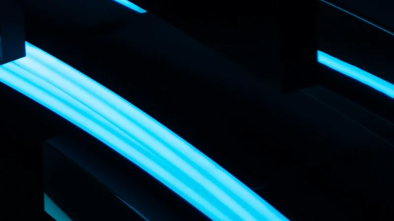 Cyan neon light strips on a dark surface